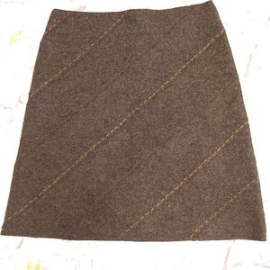 Wool shirt with decorative stitching. Size 10 - 12. New condition.